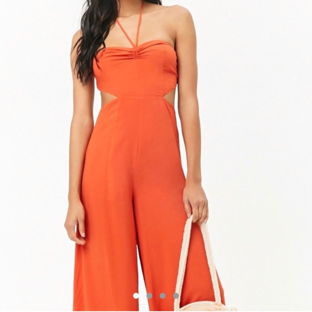 Orange romper. Open back.